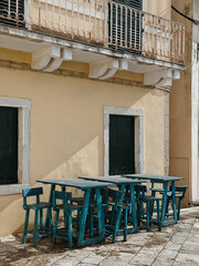 Outdoor Seating Arrangement by Yellow Wall