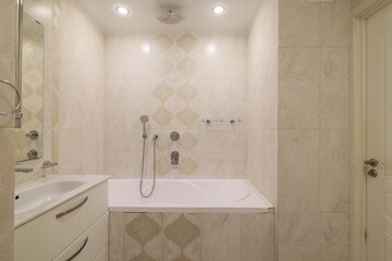 A Modern Bathroom featuring an Elegant Design complemented by a Relaxing Bathtub space