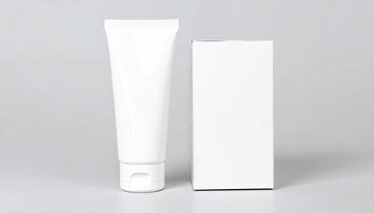 Minimalist white cosmetic tube and box on a neutral gray background