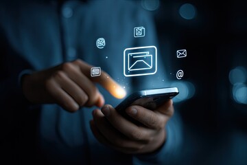 Fototapeta premium Person interacts with a phone displaying email icons