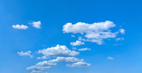 Cloudscape nature background. Blue sky and white clouds, wide panorama Free fly freedom.