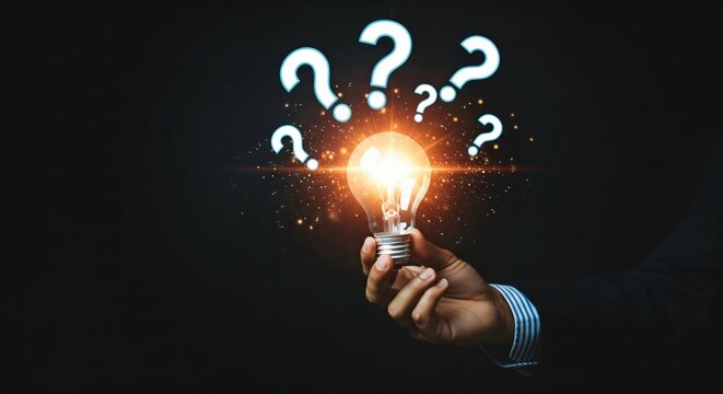 Innovative solution shines brightly as hand holds glowing bulb, answering key business questions in a modern and professional way - Powered by Adobe