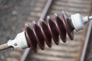 Closeup of railway ceramic insulator for overhead electric line