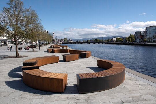 City waterfront promenade with modern seating - Powered by Adobe