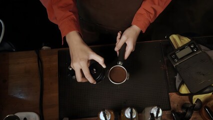 Preparing Espresso Tamping Coffee Grounds in a Portafilter