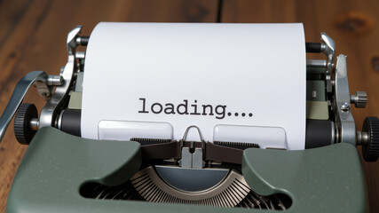 Paper in vintage typewriter with loading text and blinking dots