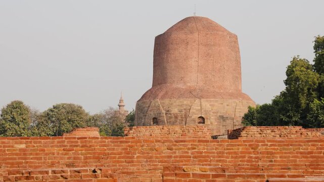 holy sarnath dhamek stupa buddhist monument with clear blue sky in daylight video is taken at Sarnath near Varanasi, India.