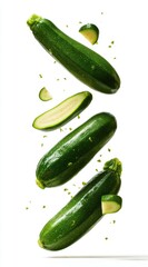 Falling Fresh Green Zucchini on White Background