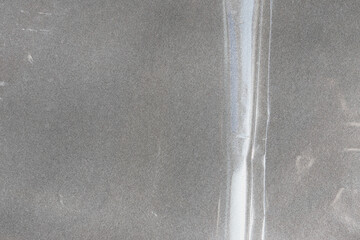 plastic transparent cellophane bag on white background. The texture looks blank and shiny. The...
