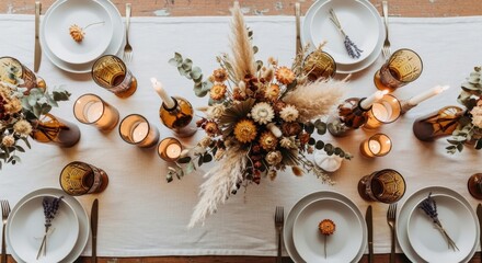 Overhead view of a beautifully decorated thanksgiving table setting with floral centerpiece