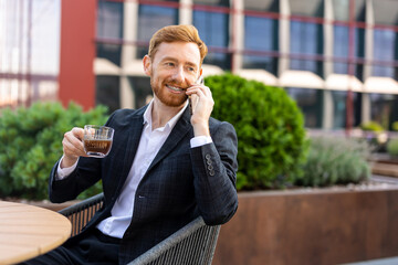 Caucasian man professional chatting on phone at city coffee shop
