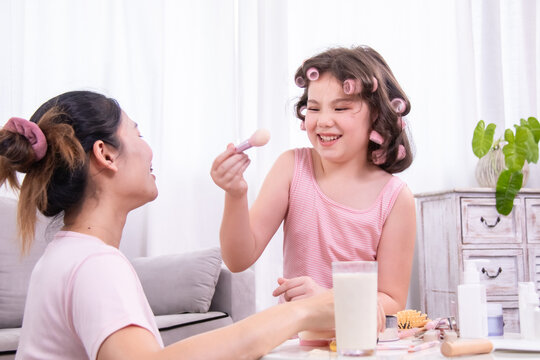 Beauty, skincare, cosmetic, mother, daughter activity highlighting affection, family trust and learning, parenting lifestyle made for blog, social media and content marketing inspiration, kid playng