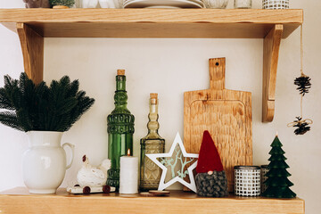Decorative holiday shelf displaying festive items and seasonal decor in a cozy home setting