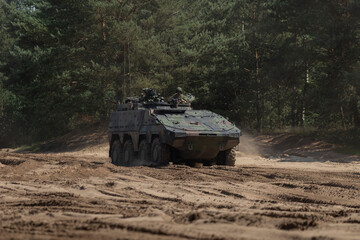 Boxer armored personnel carrier with crew during tactical field exercise © Victor