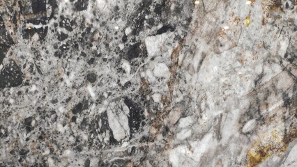 Close-up of marble ceramic tile with elegant natural patterns in gray, white, black, and gold tones, ideal for flooring, wall design, and luxurious interior decoration