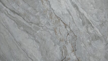 Textured close-up of natural grey marble stone surface with detailed veins and mineral patterns, perfect for backgrounds, flooring, and modern interior design concepts