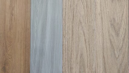 Various wood texture samples displayed in a supermarket, offered as options for flooring or wall panels, featuring natural grain patterns for home and interior building materials