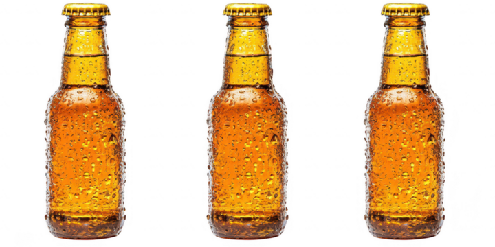 Three beer bottles with condensation on transparent png background