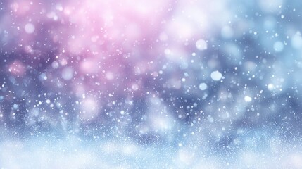 Fototapeta premium A soft, blurred background of falling snowflakes with a gradient of blue and pink hues. The scene evokes a winter atmosphere.