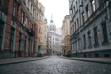Fototapeta premium A narrow, paved city street