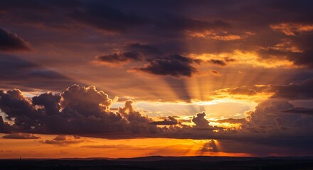 Obraz premium Sunset sky clouds dramatic colors golden rays