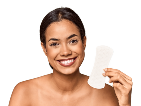 Filipino woman with sanitary pad in studio happy, smiling and cheerful.