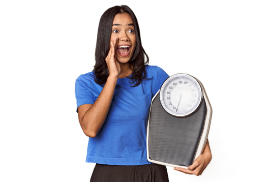 Filipino woman with scale in studio shouting and holding palm near opened mouth.