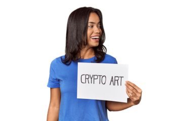 Woman with "crypto art" sign in studio looks aside smiling, cheerful and pleasant.