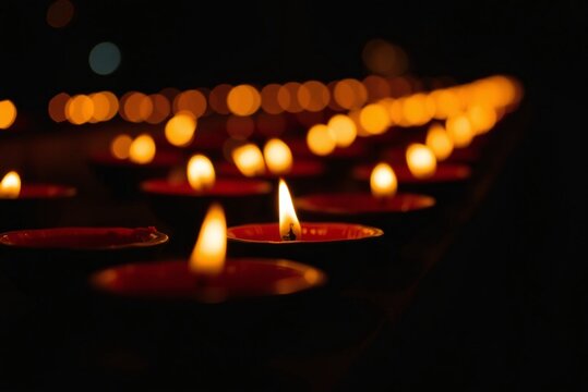 Diwali diyas with bokeh lights 