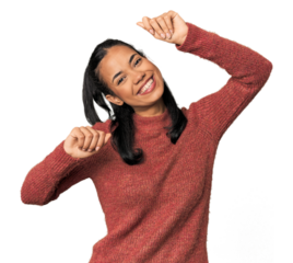 Young Filipina woman celebrating a special day, jumps and raise arms with energy.