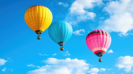 Naklejka premium Colourful Rainbow colored hot air balloons floating in the blue sky.