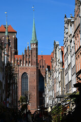 Obraz premium Gdansk, Poland. Mariacka street. St. Mary's Church or formally the Basilica of the Assumption of the Blessed Virgin Mary - brick gothic catholic church located in Gdansk