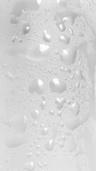 Texture of frosted serum bottle with water drops, macro skincare packaging detail, 9:16 real photo.