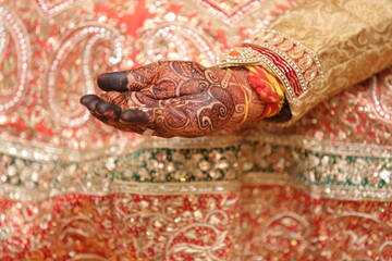 Traditional Indian Bridal Mehndi Hands with Floral Offering