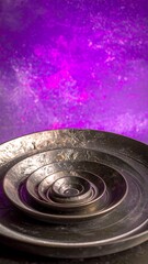 Concentric metal bowls against a vibrant purple backdrop
