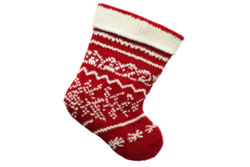 Red and white knitted christmas stocking with snowflake pattern isolated on transparent background. Traditional red and white christmas stocking with a fair isle pattern isolated on white background.