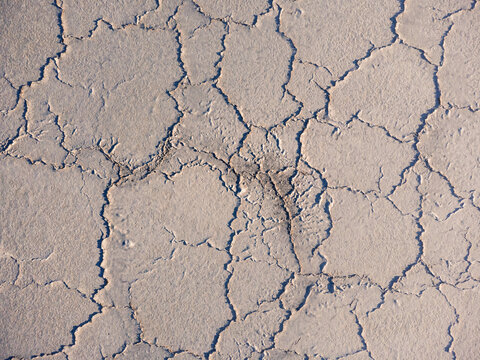 Aerial view of cracked salt flat texture