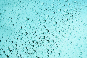 Raindrops on smooth metallic industrial object surface, weather and climate concept