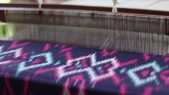 Detailed Close Up of Handwoven Ikat Textile Work with Vibrant Colorful Threads Creating Intricate Patterns on Loom a Showcasing Traditional Craft and Cultural Heritage