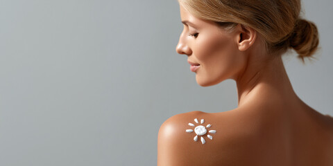 A sun-shaped sunscreen application on a woman's shoulder, promoting sun protection and skincare awareness