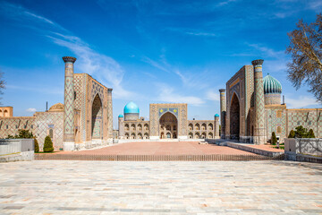 Registan Square in Samarkand, Uzbekistan, a historic architectural ensemble featuring three...