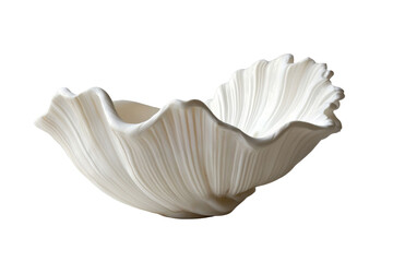 Naklejka premium Elegant white ceramic bowl with fluted edges isolated on transparent background. White scallop seashell with subtle elegant patterns and smooth ridges isolated on white background.