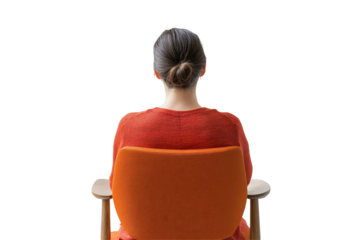 Woman in orange sweater seen from behind sitting in chair isolated on transparent background. Woman sitting chair back view isolated on white background.
