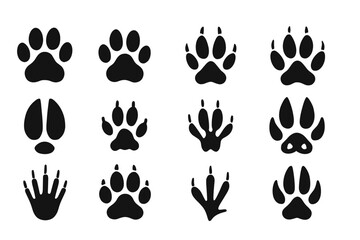 Fototapeta premium Diverse animal paw prints and tracks collection in black silhouette