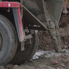 Concrete truck pouring mix onto construction site (1)