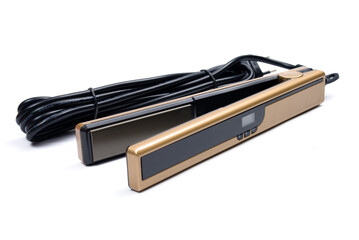 Gold eletronic hair iron straightener on white background