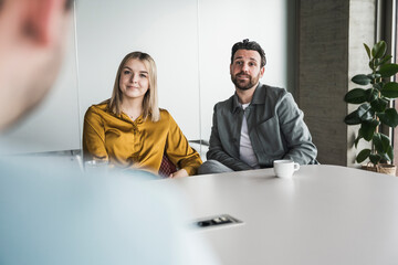 Business colleagues discussing in meeting at office