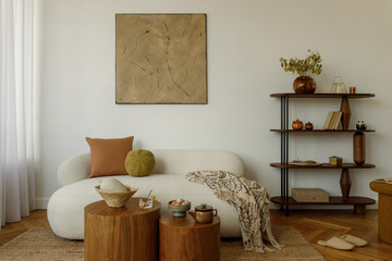 Bright living room interior with cream sofa, orange pillow, round tables  and decorative shelving...