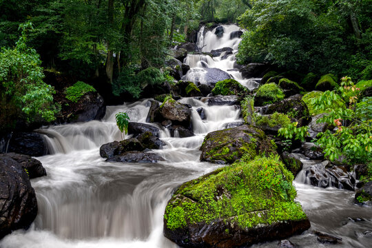 El Molino waterfall in Valle de Bravo, Mexico, surrounded by lush forest and rocks, cascading water forming a natural stream that symbolizes eco tourism, serenity, and scenic beauty in Avandaro forest