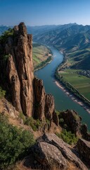 Obraz premium High-angle view of a river winding through a valley, with dramatic rock formations
